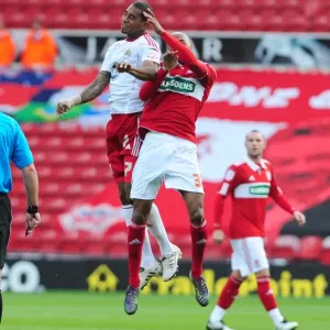 Bristol Citys Marvin Elliott battles for the ball in the air with Middlesbroughs Mickael Tavares