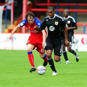 Bristol Citys Marvin Elliott battles for the ball with Aldershots Danny Hylton Bristol Citys Marvin Elliott battles for the ball with Aldershots Danny Hylton