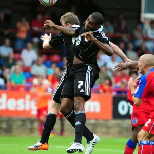 Bristol Citys Marvin Elliott and Bristol Citys David Clarkson challenge for the ariel ball Bristol Citys Marvin Elliott and Bristol Citys David Clarkson challenge for the ariel ball