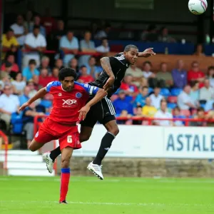 Bristol Citys Marvin Elliott challenges for the ariel ball with Aldershots Anthony Charles Bristol Citys Marvin Elliott challenges for the ariel ball with Aldershots Anthony Charles