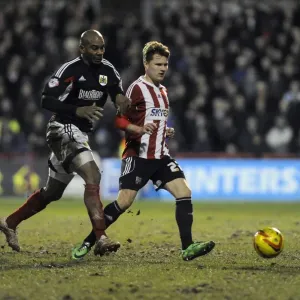 Bristol City's Marvin Elliott Closes In on Brentford's Jake Reeves in Intense League One Clash Bristol City's Marvin Elliott Closes In on Brentford's Jake Reeves in Intense League One Clash