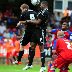 Bristol City's Marvin Elliott and David Clarkson Contest for Aerial Ball in Action- Packed Aldershot Match Bristol City's Marvin Elliott and David Clarkson Contest for Aerial Ball in Action- Packed Aldershot Match