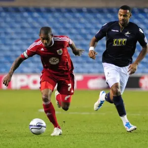 Bristol City's Marvin Elliott Outmaneuvers Millwall's Liam Trotter in Championship Clash, 12th April 2011 Bristol City's Marvin Elliott Outmaneuvers Millwall's Liam Trotter in Championship Clash, 12th April 2011