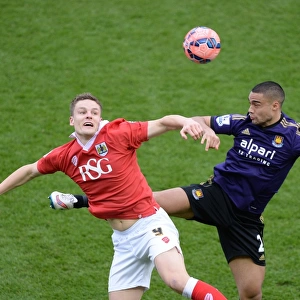Bristol City's Matt Smith Battles for High Ball Against West Ham's Winston Reid during FA Cup Fourth Round