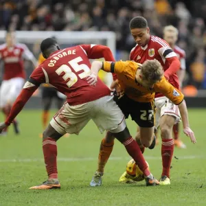 Bristol City's Osborne and Reid Tackle Michael Jacobs in Wolves vs. Bristol City Football Match, Sky Bet League One