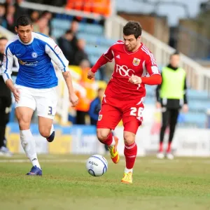 Bristol City's Richard Foster Outmaneuvers Peterborough's Matthew Briggs During the 2012 Match