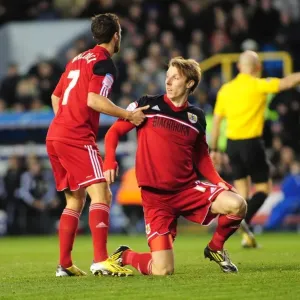 Bristol City's Sam Baldock Consoles Teammate Martyn Woolford After Tackle during Millwall vs Bristol City Championship Match