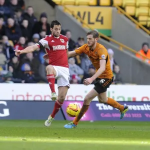 Bristol City's Sam Baldock Faces Pressure from Wolverhampton Wanderers Danny Batth in Sky Bet League One Clash
