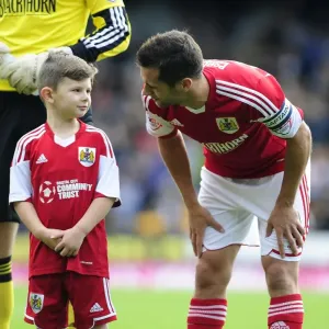 Bristol City's Sam Baldock and Mascot Celebrate Victory at Vale Park