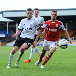 Bristol City's Sam Baldock Outmuscles Port Vale's Adam Yates for the Ball