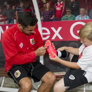 Bristol City's Scott Murray Signs Young Fan's Football Boot at Ashton Gate Bristol City's Scott Murray Signs Young Fan's Football Boot at Ashton Gate