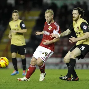 Bristol City's Simon Gillett Evades Challenge from Leyton Orient's Romain Vincelot