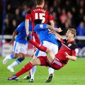 Bristol City's Steven Davies Fouled by Lee Tomlin in Peterborough United Championship Clash Bristol City's Steven Davies Fouled by Lee Tomlin in Peterborough United Championship Clash