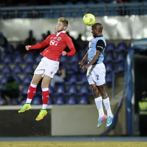 Bristol City's Wes Burns Battles for the Header in Botswana Tour Match Bristol City's Wes Burns Battles for the Header in Botswana Tour Match