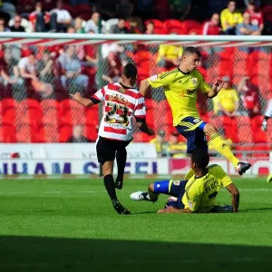 Print of Bristol City players in action