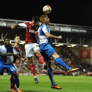 Bristol Derby: Intense Battle for the High Ball between Marlon Pack and Matt Harrold