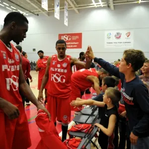 Bristol Flyers Doug Herring and Excited Fan Celebrate in British Basketball Cup Match Bristol Flyers Doug Herring and Excited Fan Celebrate in British Basketball Cup Match