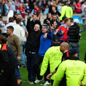 Burnley Fans Invade the Pitch: A Moment from the Burnley vs. Bristol City Match