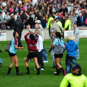 Burnley fans on the pitch