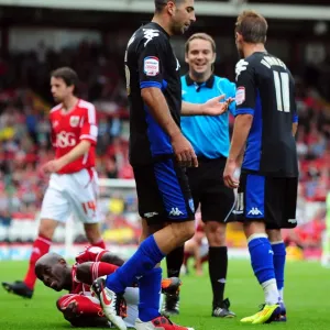 Championship Football: Tal Ben Haim of Portsmouth Yelled for Foul on Jamal Campbell-Ryce of Bristol City (August 2011) - Ben Haim Receives Yellow Card