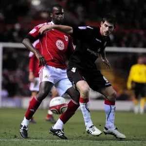Championship Showdown: Cisse vs Evans - Intense Battle for Ball Possession (Bristol City vs Sheffield United)