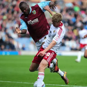 Championship Showdown: Burnley's Andre Bikey Fouls Jon Stead of Bristol City (September 25, 2010) Championship Showdown: Burnley's Andre Bikey Fouls Jon Stead of Bristol City (September 25, 2010)