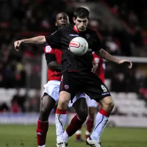 Championship Showdown: Cisse vs Evans - Intense Battle for the Ball (Bristol City vs Sheffield United, 27/11/2010)