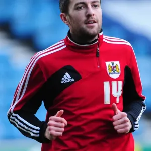 Championship Showdown: Cole Skuse of Bristol City Faces Off Against Millwall