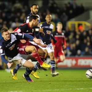 Championship Showdown: Millwall's Shane Lowry Tackles Sam Baldock of Bristol City