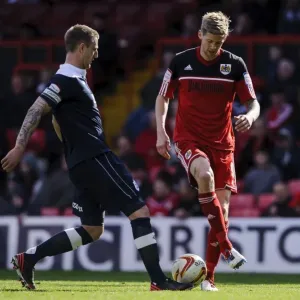 Championship Showdown: Stead vs. Clarke - A Football Battle at Ashton Gate (Bristol City vs. Huddersfield)