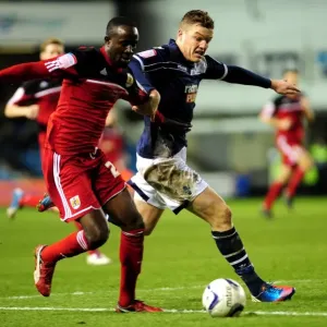 Chasing the Win: Intense Moment as Millwall's Shane Lowry Chases Down Albert Adomah of Bristol City