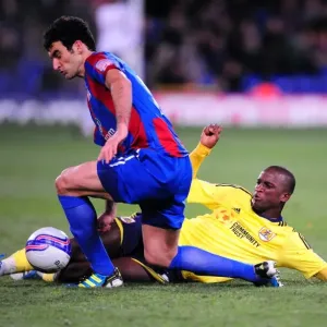 Print of a tackle between Kalifa Cisse and Mile Jedinak