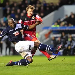 Clash at The Den: Martyn Woolford Thwarted by Danny Shittu