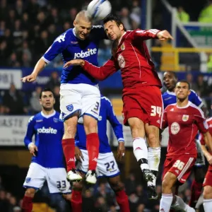 Clash at Fratton Park: Dickinson vs. Pitman Battle for Aerial Supremacy in Portsmouth vs. Bristol City Championship Clash (September 2010)