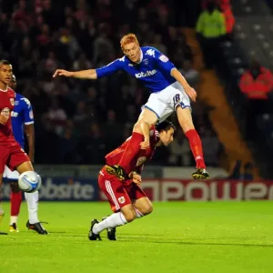 Clash at Fratton Park: Skuse vs. Kitson - Championship Showdown between Bristol City's Cole Skuse and Portsmouth's Dave Kitson, September 2010