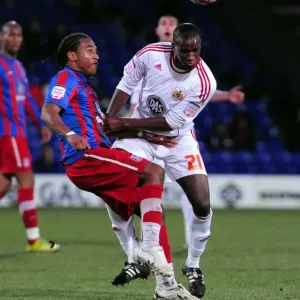 Clash at Selhurst Park: Kalifa Cisse Braves the Pain Against Neil Danns, Crystal Palace vs. Bristol City, Championship 2011