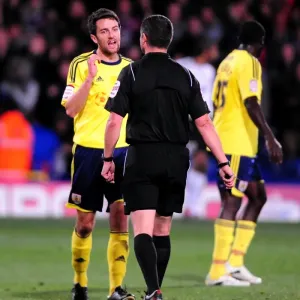 Cole Skuse protests to referee in print