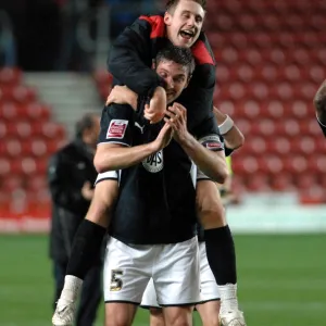 David Noble and Jamie McCombe celebrate on the final whistle