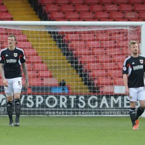 Dejected Duo: Aden Flint and Wade Elliott after Bristol City's 3-0 Defeat at Bramall Lane Dejected Duo: Aden Flint and Wade Elliott after Bristol City's 3-0 Defeat at Bramall Lane