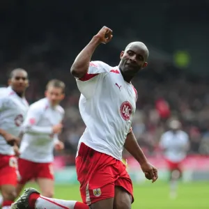 Dele Adebola celebrates