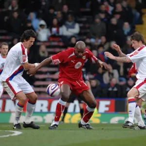 Dele Adebola fights off attention from john oster and Jose Fonte Dele Adebola fights off attention from john oster and Jose Fonte