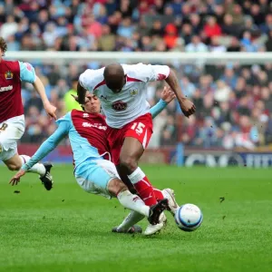 Dele Adebola is tackled by Rhys Williams
