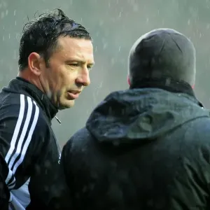 Print of Derek McInnes and Gianfranco Zola confer after match Print of Derek McInnes and Gianfranco Zola confer after match