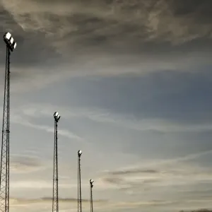 FA Cup Sunset Print: Silhouette of Cameraman and Floodlights