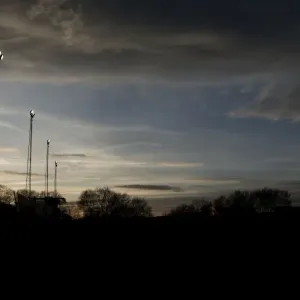 FA Cup Sunset Print: Silhouette of a Cameraman and Floodlights