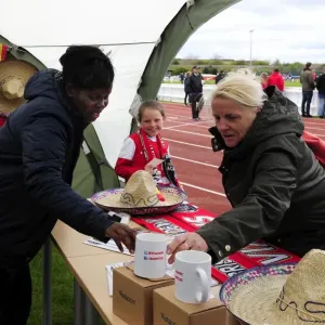 Fan Exploring Bristol Academy Women's Merchandise at Gifford Stadium during BAWFC vs Chelsea Ladies Match
