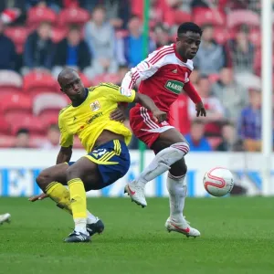 Football Rivalry: Cisse vs. Ogbeche at Riverside Stadium (2012) - Bristol City's Kalifa Cisse and Middlesbrough's Barthomew Ogbeche in a Tight Battle for the Ball Football Rivalry: Cisse vs. Ogbeche at Riverside Stadium (2012) - Bristol City's Kalifa Cisse and Middlesbrough's Barthomew Ogbeche in a Tight Battle for the Ball
