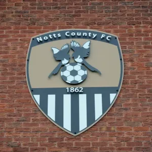 Football Rivalry at Meadow Lane: Notts County vs. Bristol City (August 2014) - Brick Wall Showcases Notts County Crest Football Rivalry at Meadow Lane: Notts County vs. Bristol City (August 2014) - Brick Wall Showcases Notts County Crest