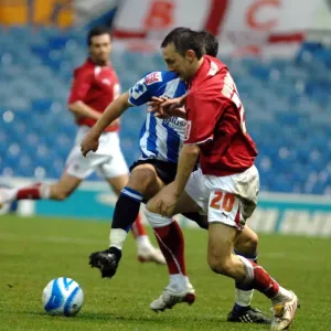 Gavin Williams tussles in midfield