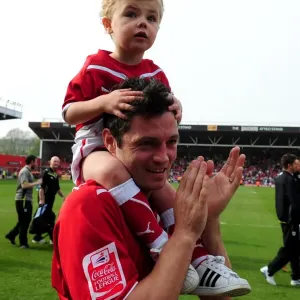 A Heartwarming Moment: Ivan Sproule of Bristol City Shares the Pitch with His Son during the 2010 Championship Match against Derby County A Heartwarming Moment: Ivan Sproule of Bristol City Shares the Pitch with His Son during the 2010 Championship Match against Derby County
